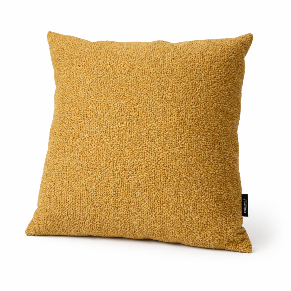 Mustard yellow textured pillow on a white background